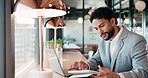 Businessman, tablet and remote work in cafe with laptop, reading and typing report for tax return. Accountant, person and scroll in restaurant with tech, wealth management or revenue service website.