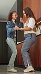 Mom, girl and dancing with smile in kitchen with love, bonding and care for connection in house. Happy people, mother and daughter with rhythm, holding hands or excited with laugh at family home