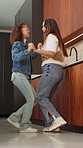 Mom, girl and happy with dancing in kitchen with love, bonding and care with connection at house. People, mother and daughter with smile for rhythm, holding hands or excited with laugh at family home