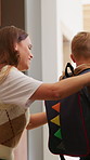 Mom, child and help in home with backpack, morning routine and getting ready for daycare education. Woman, young son and assistance in house with bag, preparation and creche for learning development.