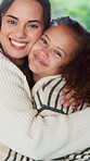 Face, mother or daughter in house with love, family hug or bonding together for child growth. Smile, kid or woman with embrace, healthy relationship or parent connection for childhood development.