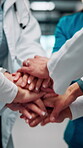 Group, hands and doctors together for celebration, success or hospital achievement in circle. Stack, nurse and medical people with applause for good news, clinic excellence and healthcare teamwork