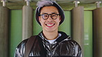 Happy, face and asian man for education, learning and college with glasses, vision and outdoor. Campus, cool and pride of student or person with happiness for creative academy, scholarship or study