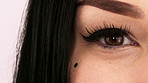 Cosmetics, eyeliner or eye with lashes, glam style or length boost in makeup results. Beauty, microblading or female person with blink, dramatic extension or bold transformation on studio background
