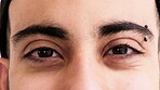 Eyecare, face and man with vision in closeup for optical assessment, eyesight test and piercing. Optometry, healthcare and person with eye examination for cornea disease, ocular pressure and wellness