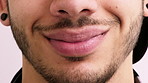 Happy, smile and mouth of man in studio for positive attitude, good mood and optimism. Closeup, face and person with emotion, facial expression and reaction for confidence on white background