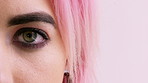 Face, optometry and eye of woman in studio for eyesight, vision test and optical exam for glasses. Optician, half and portrait of person for health, eyecare and prescription lens on pink background