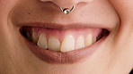 Happy, smile and mouth of woman in studio for positive attitude, good mood and optimism. Closeup, face and person with emotion, facial expression and nose ring for confidence on white background