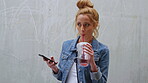 Education, juice and phone with woman student outdoor for learning or university study with space. College, drink and school with pupil on concrete background at campus for knowledge or text message