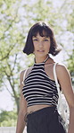 Outdoor, face and woman with pride for fashion, university student and serious with stylish clothes. College, tennis net and person with confidence for streetwear, attitude or cool with trendy outfit