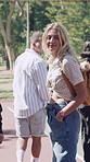 Face, woman and friends outdoor with fashion, trendy outfit and confident walk for social gathering. Happy, people and hangout with summer clothes, bonding together and casual style on weekend break.