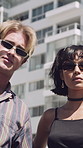 Friends, face and urban fashion with confidence in city for clothing style, sunglasses or trend. Portrait, people or group with streetwear, pride or arms crossed for stylish or casual outfit in town
