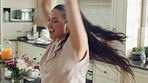 Happy, dancing and woman with music in kitchen for positivity, good mood and energy in home. Apartment, weekend and person with movement, rhythm and spin for break, me time and relax with radio