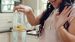 Blender, dance and woman singing in kitchen for healthy food, wellness and breakfast at home. Music, good mood and happy person with smoothie drink for morning nutrition, detox or vegan diet