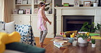 Dance, child and girl with laptop in living room, sassy movement and internet tutorial for weekend fun. Energy, learning and happy kid with music video for choreography practice, home and computer