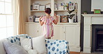 Dancing, child and girl with smile in living room, playful movement and expression for weekend break. Energy, music and happy kid with performance for childhood activity, entertainment or fun in home