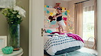 Dance, bed and girl with teddy bear for fun, play and happy for holiday or weekend at home. Spinning, joy and child in good mood with toy for childhood, imagination and celebration in morning