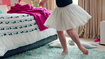Ballet, dance and child in bedroom, legs and practice for school play or moving with energy in home. Ballerina, performance and rehearsal with tutu in house, rhythm and kid with costume on weekend