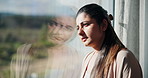 Window, thinking and sad woman with depression, mental health or remember memory for grief in apartment. Space, reflection and lonely person in home with despair, contemplation or mourning on weekend