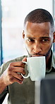 Man, coffee cup and laptop in office with review, project management and flavor at company. Person, mug and warm beverage with tea, insight or computer for solution with career at creative agency