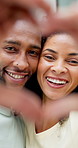 Face, smile and couple with heart hands in house for support, commitment and connection for bonding. Portrait, happiness or African people with love gesture for romance, healthy relationship or trust
