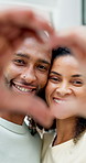 Face, smile and couple with heart hands in home for support, commitment and connection for bonding. Portrait, happiness and African people with love gesture for romance, healthy relationship or trust
