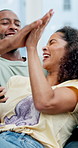 African couple, high five and surprise with phone in home for winner, success or prize. Excited, celebration and happy man with woman for good news, lottery or achievement with online competition