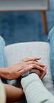 Comfort, couple and holding hands for support on couch, empathy and compassion for partner assurance. Console, sympathy and people with security for emotional healing, connection and safety in home