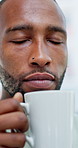 Black man, coffee and smell with smile in home for aroma, thinking and reflection with beverage on break. Person, happy and memory with flavor, scent or relax with drink  for inspiration at apartment