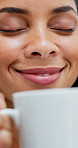Woman, coffee and smell with smile in home for aroma, thinking and reflection with beverage on break. Person, happy and memory with flavor, scent or relax with hot drink  for inspiration at apartment