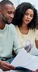 Couple, documents and budget in home with stress, frustrated and asset management in living room. African people, debt and hug with support for financial review, bills and tax compliance at apartment