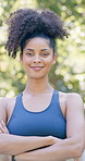 Outdoor, face or woman with arms crossed for fitness, cardio training or weekend routine for health. Portrait, bokeh  and runner in park for endurance practice, smile or confidence for wellness goals