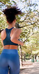 Running, back and couple with workout in park, summer training and cardio challenge for wellness. Outdoor, fitness and people with aerobic exercise for endurance development, jog or practice together