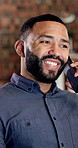Man, smile and talk in office with phone call, feedback or planning for digital marketing project. Coworking, person and typing in business with tech, contact or conversation for advertising campaign