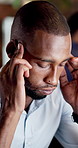 Businessman, stress and headache in office with problem, work challenge and deadline pressure at night. Late, coworking and tired person in workplace with burnout, migraine and fatigue for overtime.