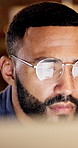 Business, man and reading with computer in office for editing, research and story update at night. Editor, glasses and pc reflection with email, confirm source and working late on article publication