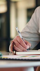 Businessman, hand and writing in office with notebook, productivity data and goal setting for KPI. Person, efficiency analysis and task priority with diary notes, graphs or stats for time management.