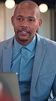 Talking, business and black man in meeting at night for finance review, proposal and investment. Corporate, team and person in discussion for financial report, consulting and planning for budget