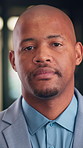 Face, serious and businessman with confidence in office, housing market industry and real estate seller. Portrait, professional and African realtor with property management, rental agency and pride