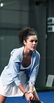 Sports, padel or woman with racket for swing practice, concentration or training for coordination. Fitness, tennis gear or serious player with ball hit for skill development, active or game on court