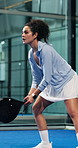 Fitness, padel and woman with racket on court, concentration and sports training for coordination. Workout, tennis gear and player with practice game for skill development, active and swing for ball