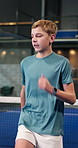 Tennis, boy and child on court with warm up drill, development and exercise for sports performance. Teen kid, cardio or running workout at padel club with hobby, training or preparation for practice.
