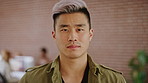 Face, business and creative man in office, about us and brand designer coworking in startup. Portrait, serious professional and employee with job opportunity, career growth or marketing worker