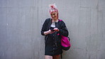 Outdoor, student and woman with phone, reading college newsletter and check message notification. Internet meme, space and happy person with mobile app by wall, web chat and scroll campus forum