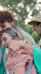 Excited, people and dancing with hug at festival for fun, celebration and energy at live concert. Friends, laugh and embrace for social gathering, freedom and moving with rhythm at outdoor rave party