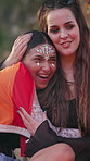 Festival, lgbt and women with hug for support, bonding experience and bonfire for weekend celebration. Embrace, care and lesbian couple with fun at summer event, nature and smile for outdoor concert