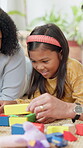 Learning, family and child with building blocks on floor for education toy and bonding in home. Happiness, support and people or parents with daughter for shape, activity and creative development
