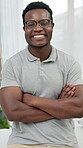 Physiotherapist, face and man with arms crossed in clinic, happy and confident for healthcare career. Portrait, black person and pride for physical therapy services, wellness and rehabilitation
