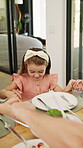 Praying, lunch and holding hands with child in home for connection, religion and support. Faith, gratitude and worship with people in dining room of family house for grace, blessing and love