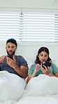 Couple, phone and texting in bed with scroll for social media addiction, post or dopamine at apartment. People, typing and check notification with mobile app, chat and contact with blanket in home
